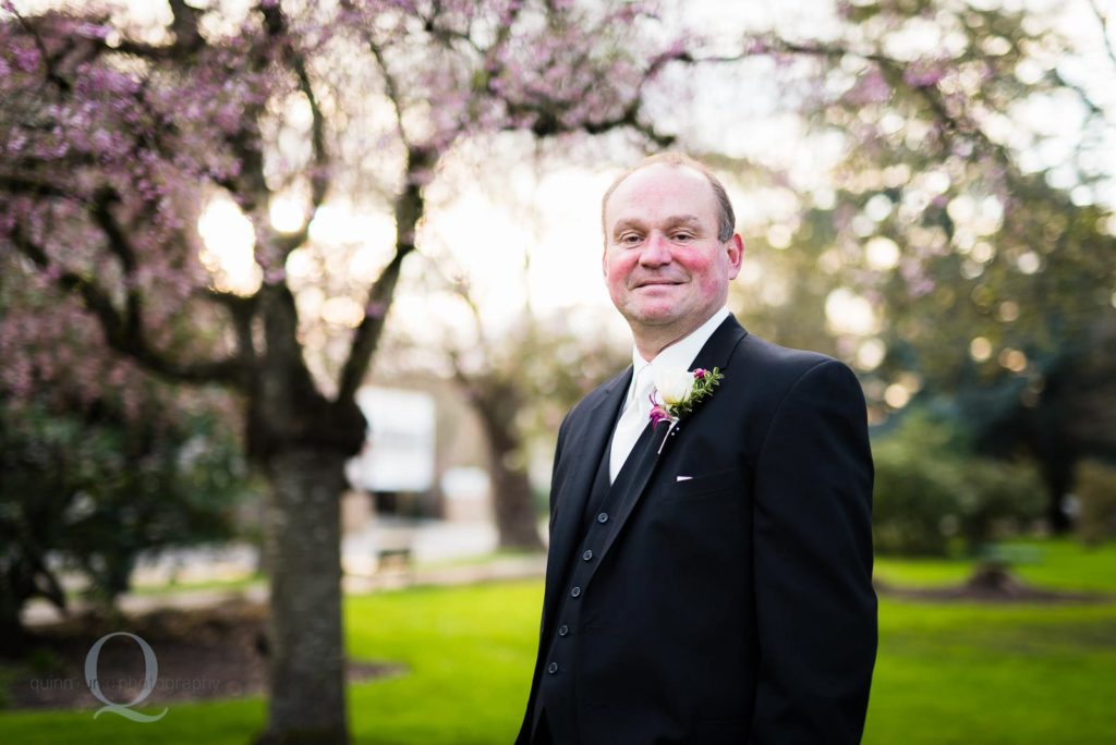 groom portrait at the park