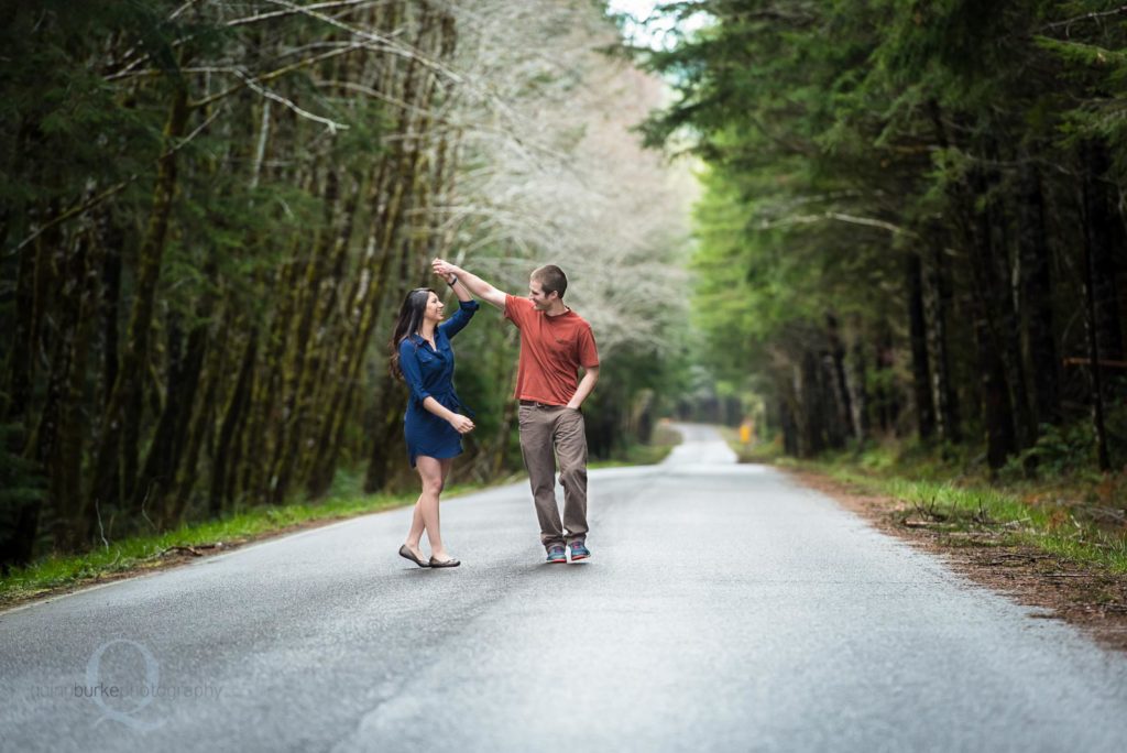engagement photo twirl in road