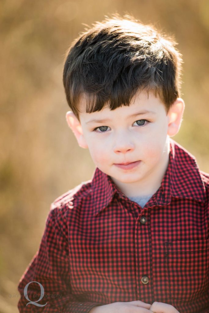 boy portrait outside golden sun