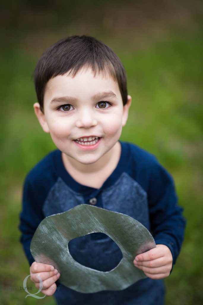 boy holding O family portrait