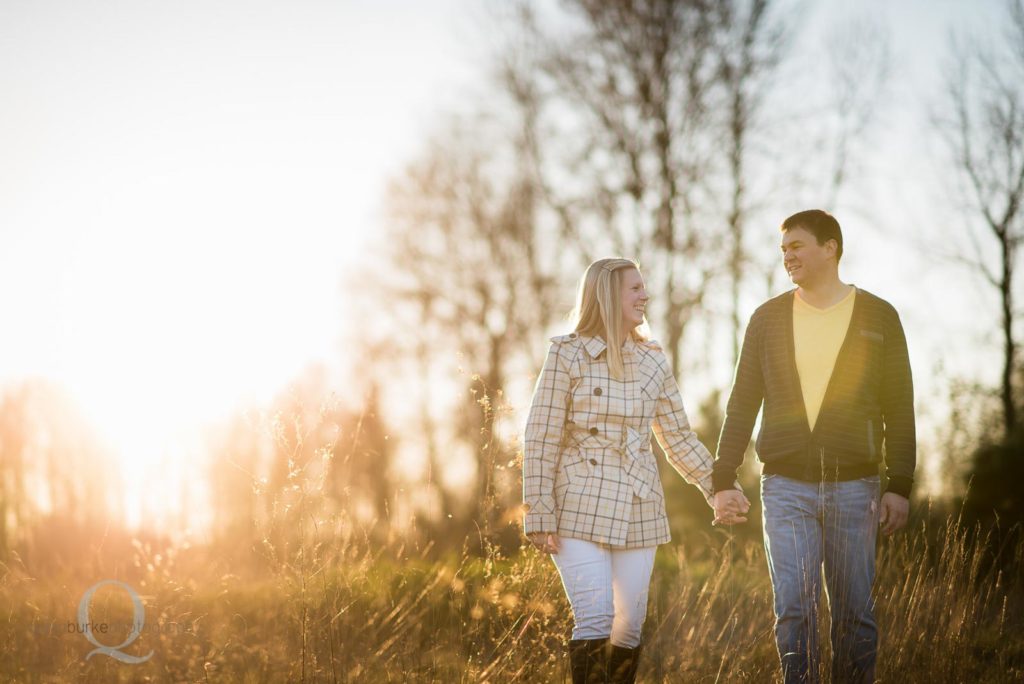 engagement photo walking in field