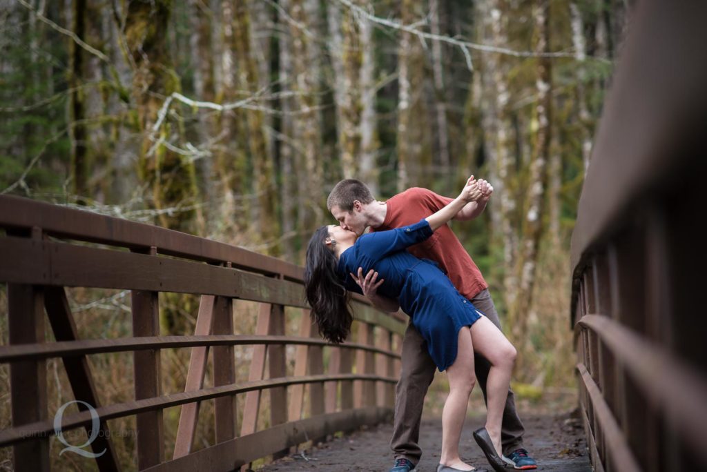 engagement photo dip kiss on bridge