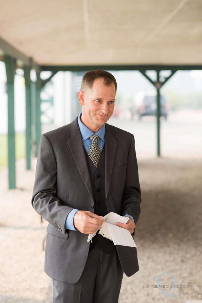 groom reading letter from bride