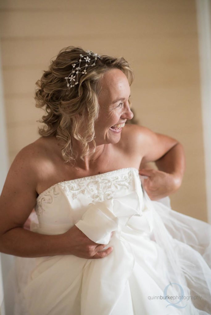 bride smiling with dress