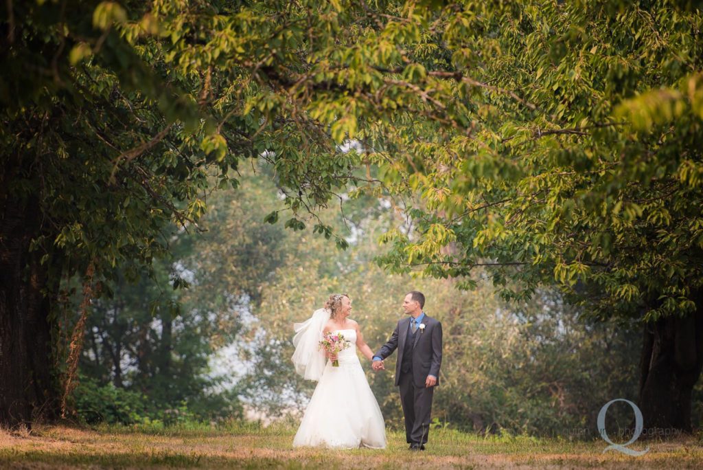 bride groom walk in orchard