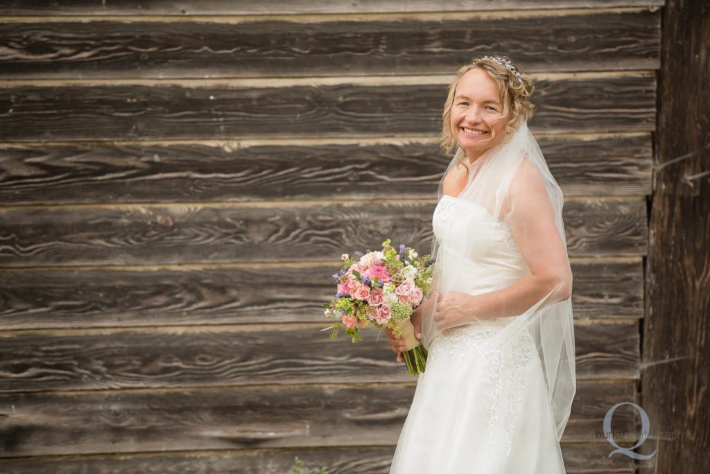 bride portrait against barn