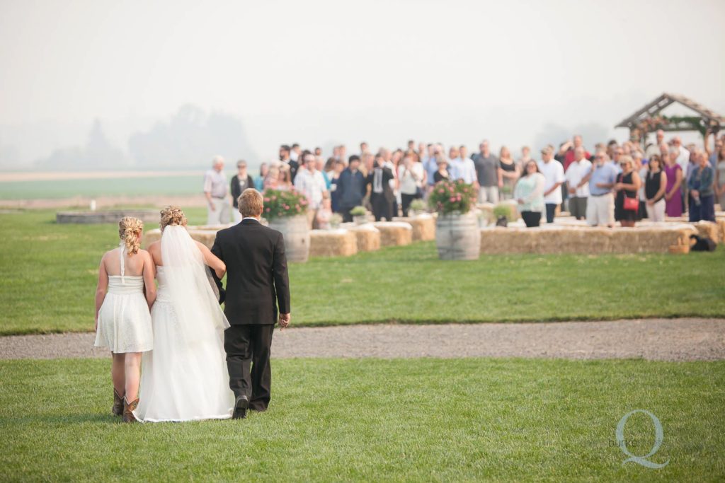 children walking mom down aisle wedding