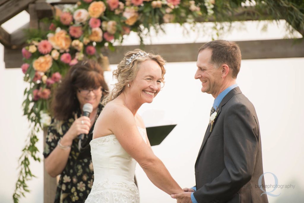 bride laughs during ceremony