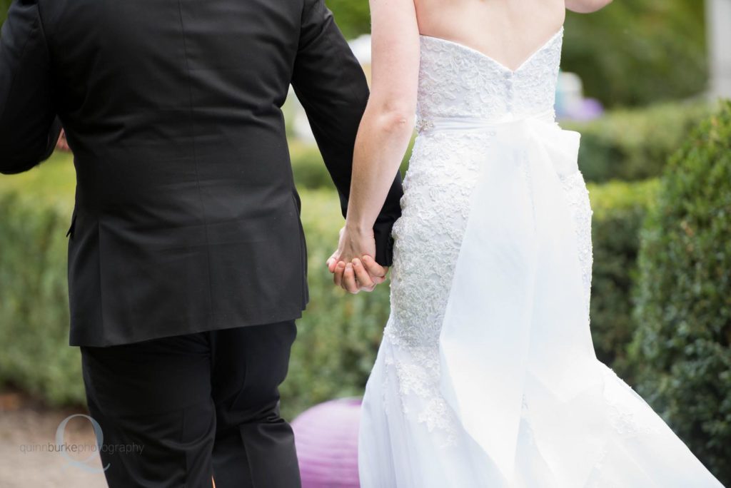 bride groom holding hands