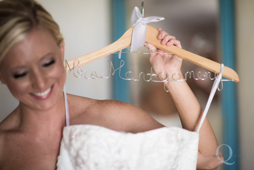 bride holding wedding dress