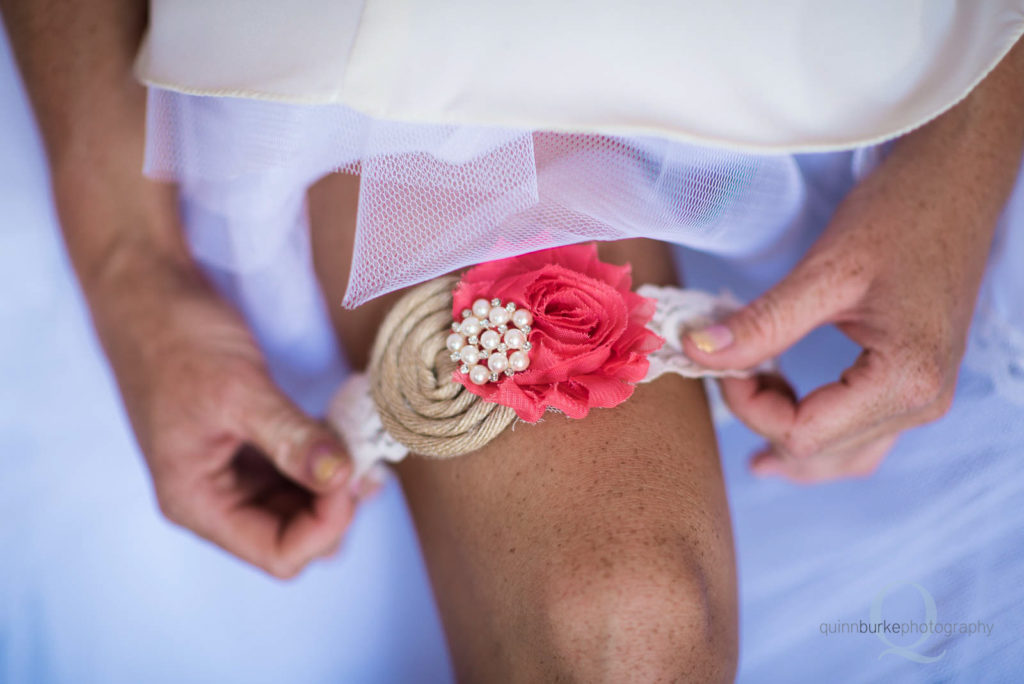 bride putting on garter