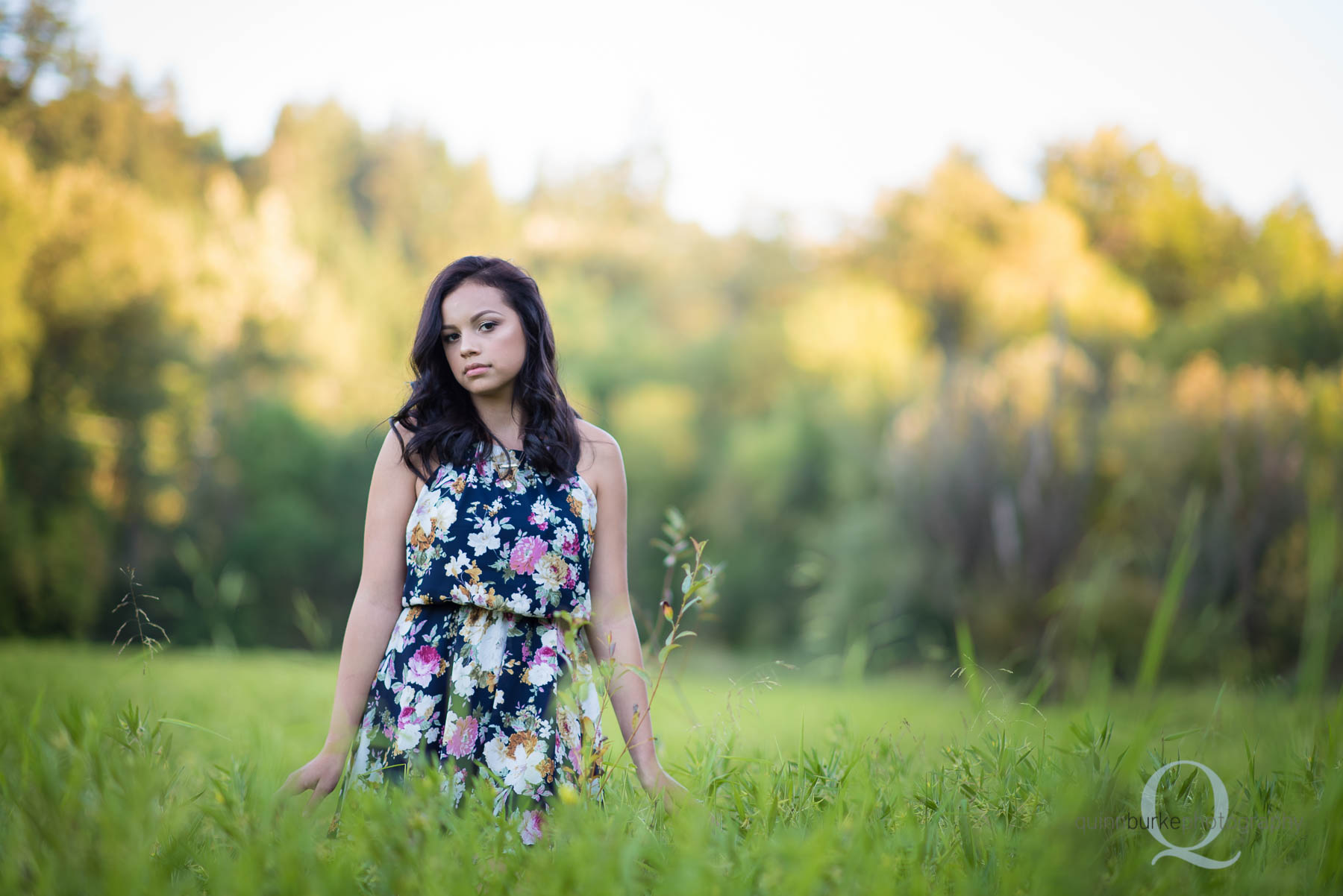 senior portrait in green grass