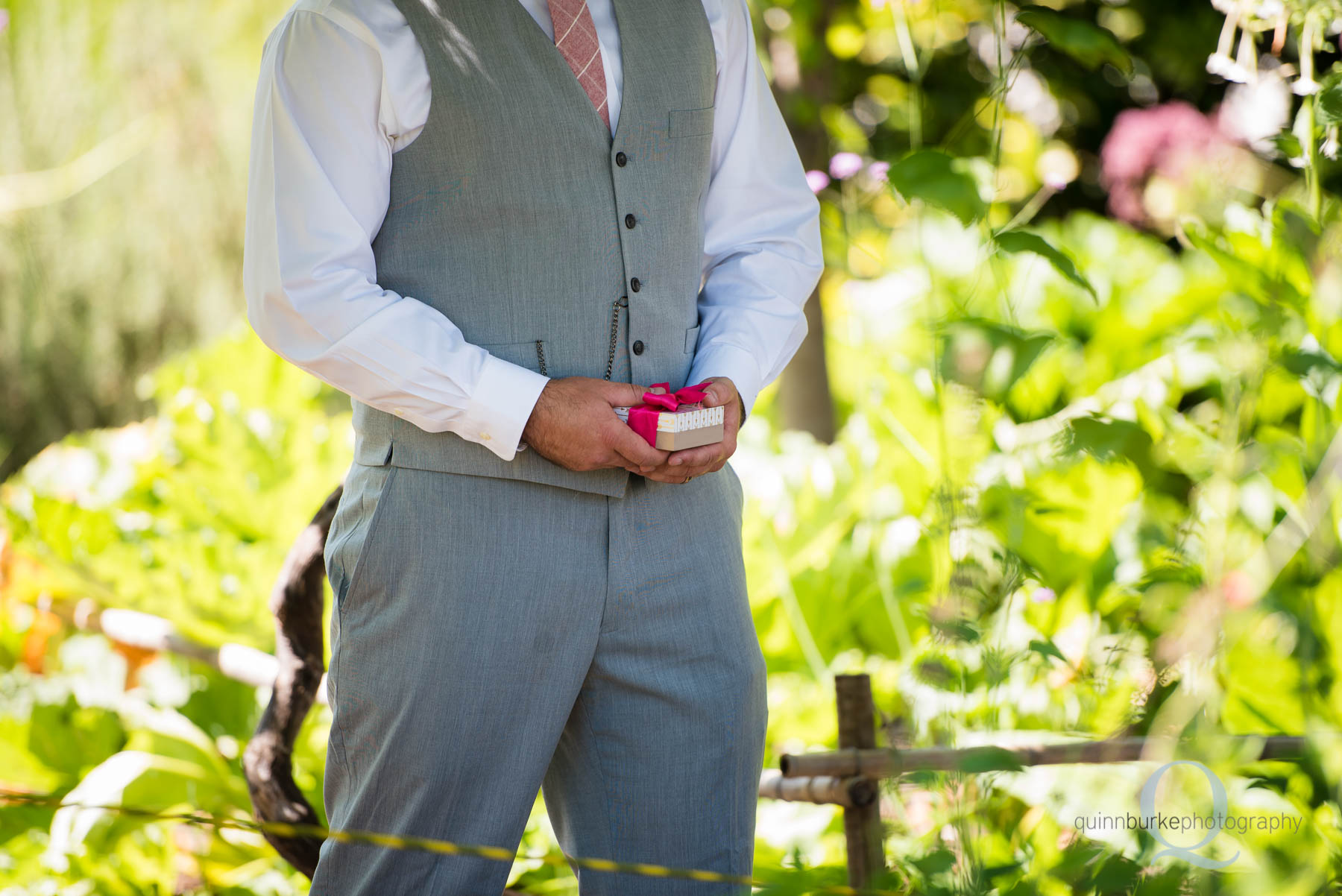 groom waiting for bride with gift