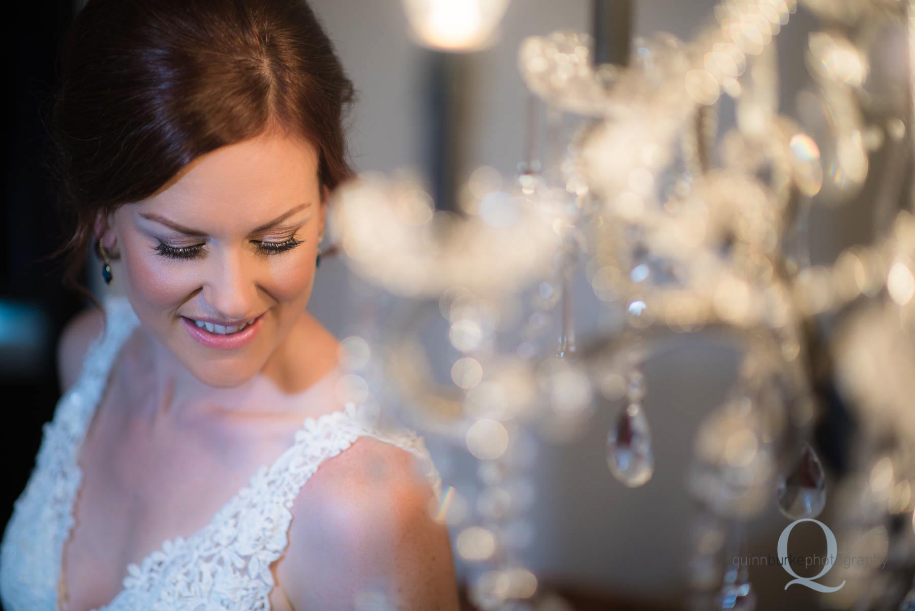 bride by chandelier getting ready Old Schoolhouse Newberg