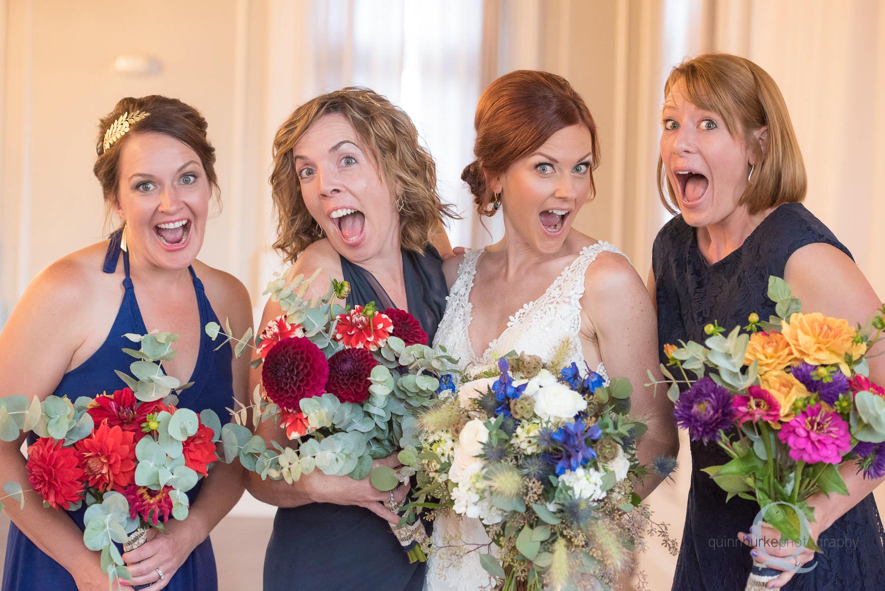 bride and bridesmaids silly face before wedding