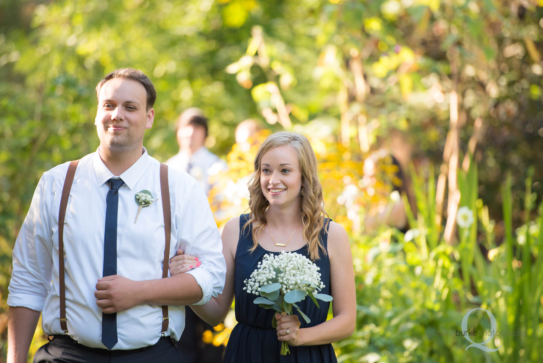 bridesmaid groomsmen walking at rons pond wedding