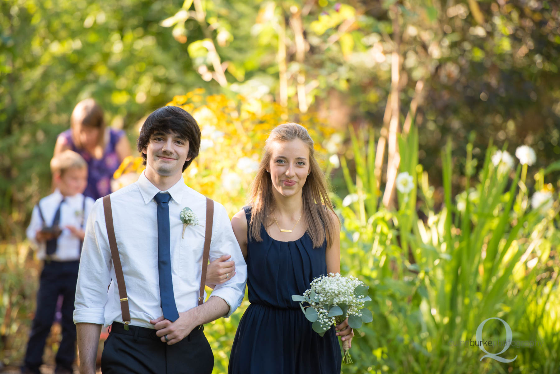 bridesmaid groomsmen walking at rons pond wedding