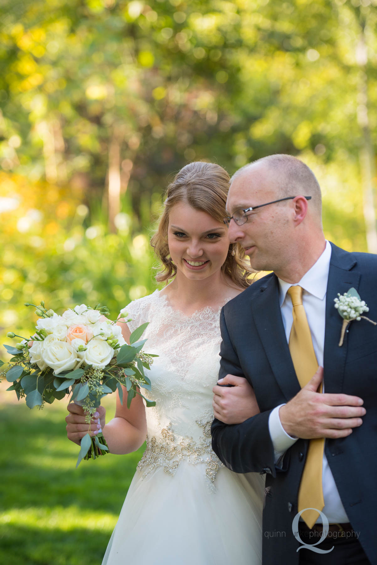 bride walking with dad down aisle rons pond wedding