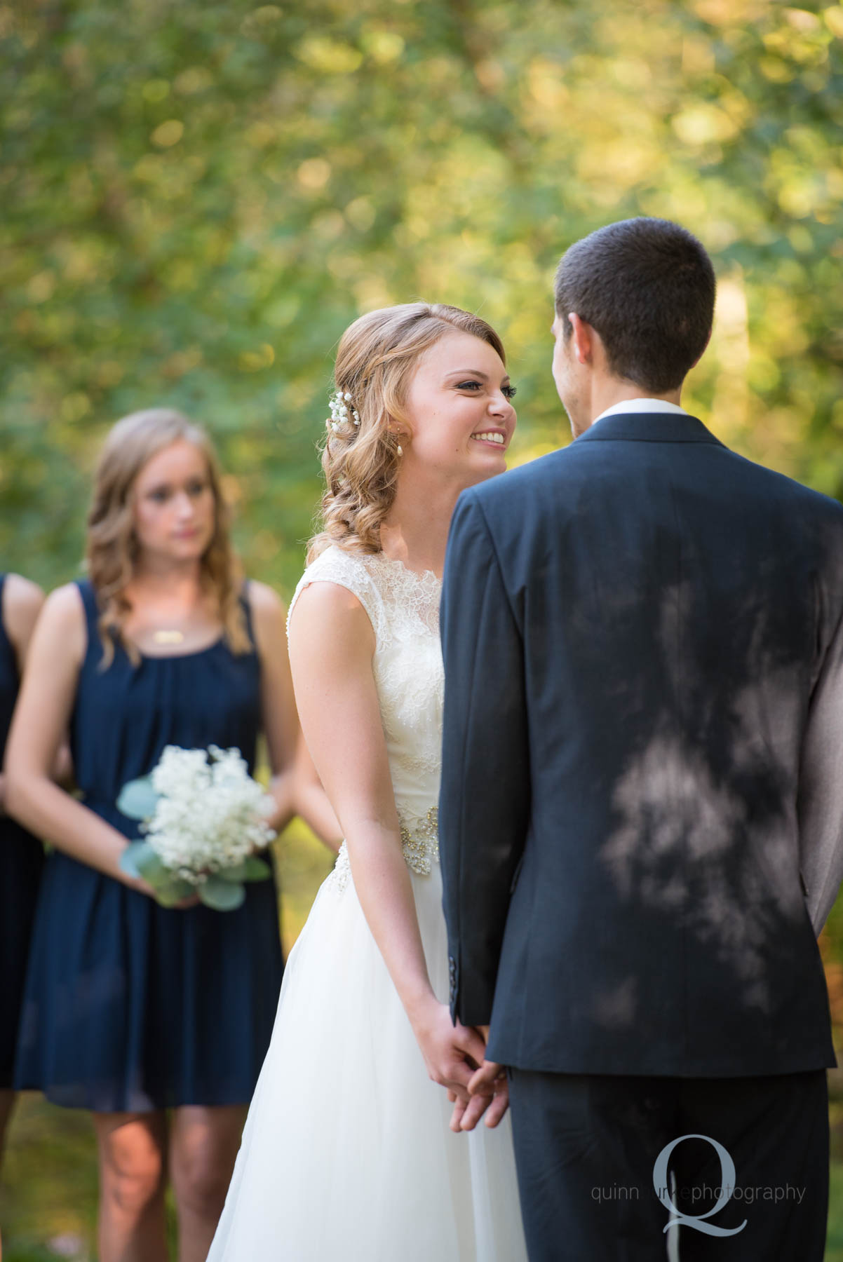 bride smiling during ceremony at rons pond