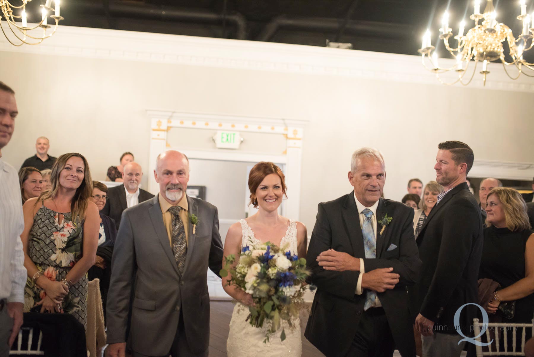 dad and step dad walking bride down aisle