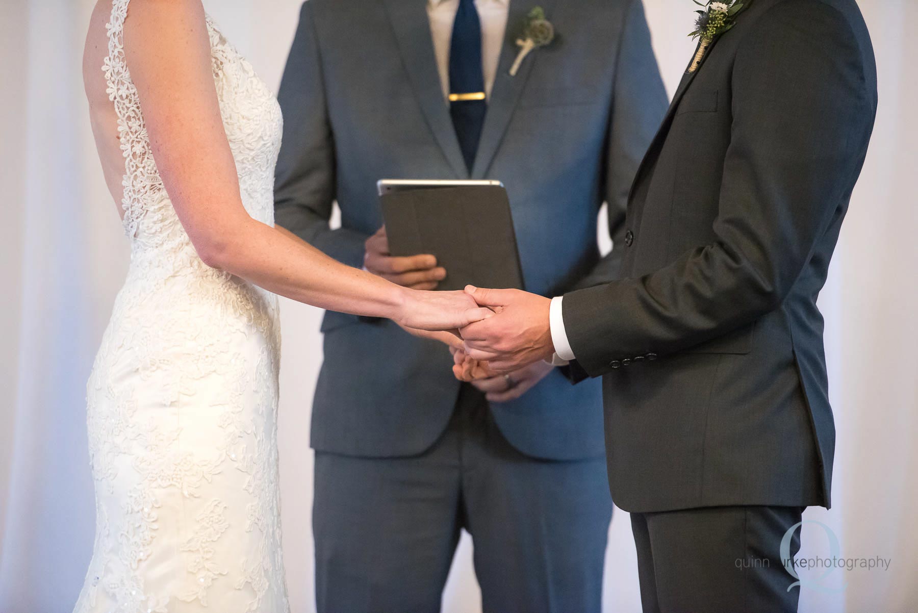 bride and groom holding hands during wedding ceremony Old Schoolhouse Newberg