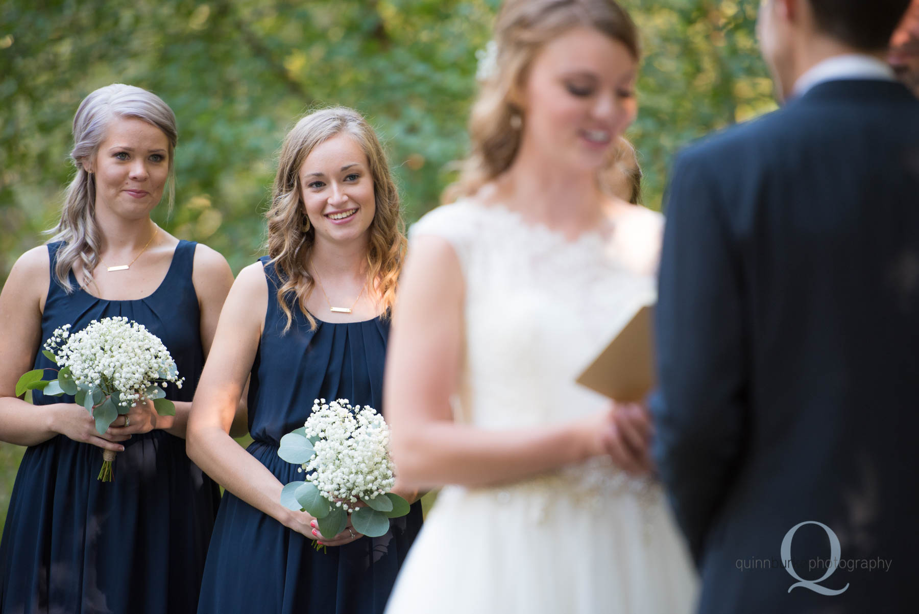 bridesmaid smiling during wedding ceremony rons pond