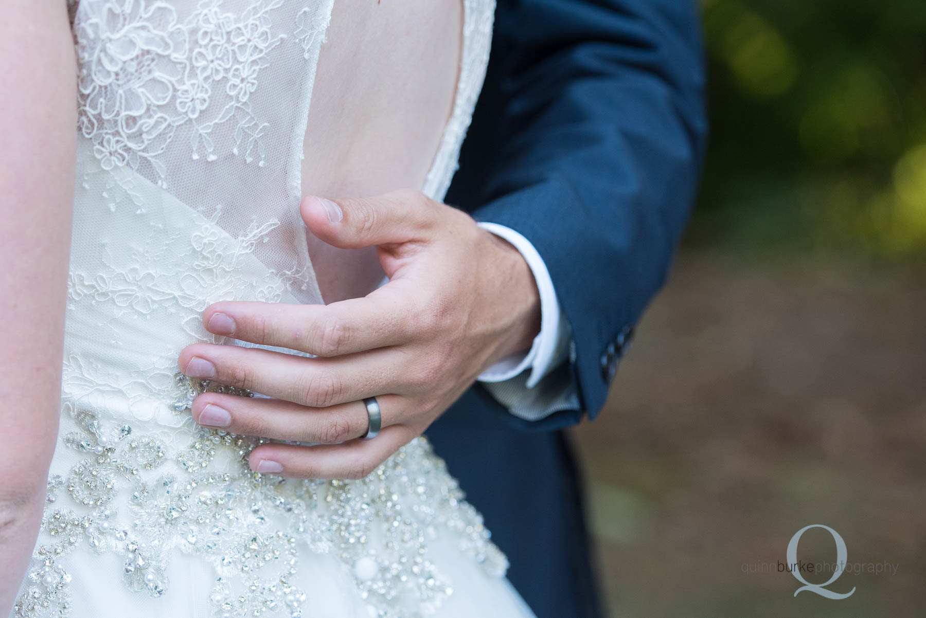 grooms hand on bride