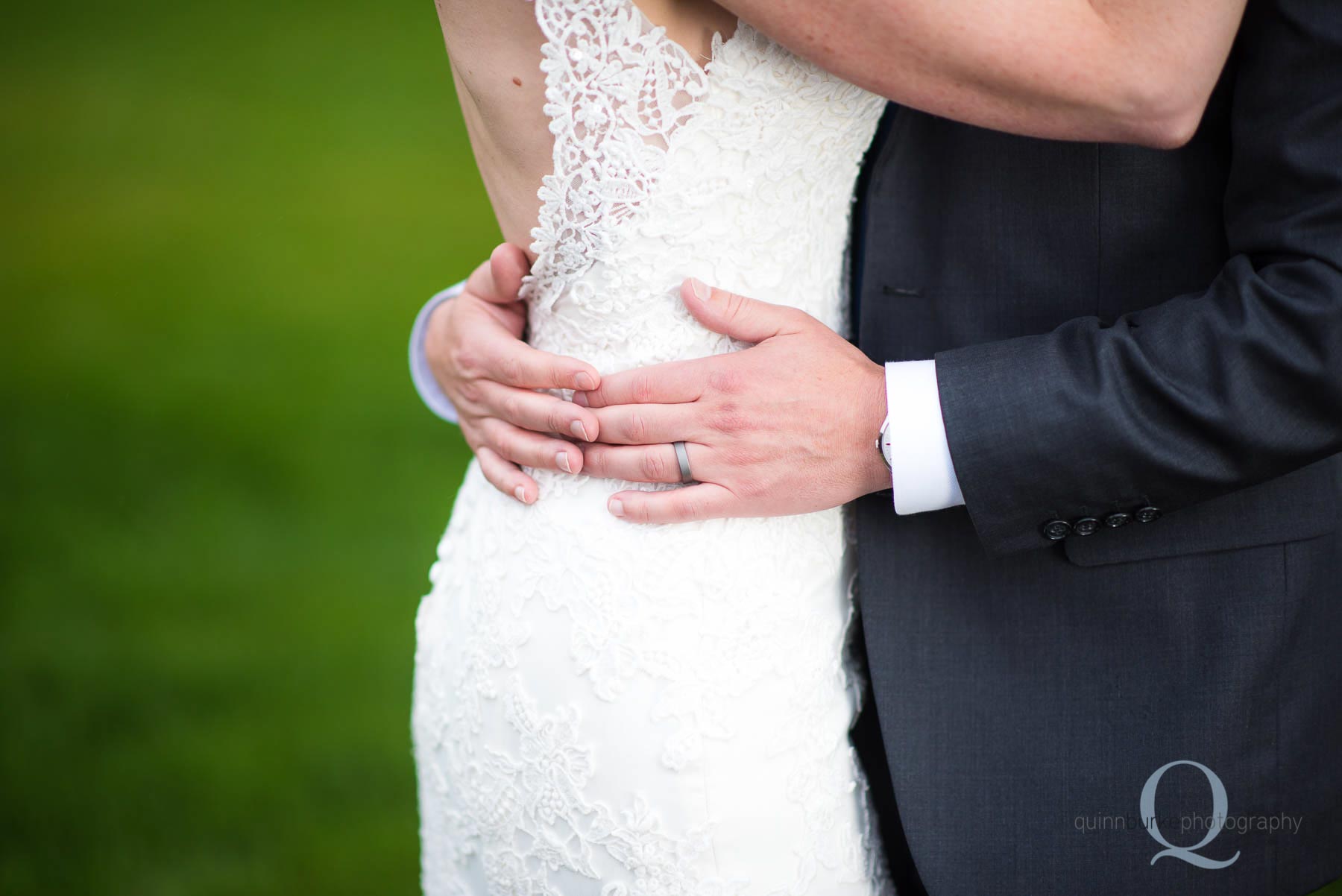 groom hands around brides waist Old Schoolhouse Newberg