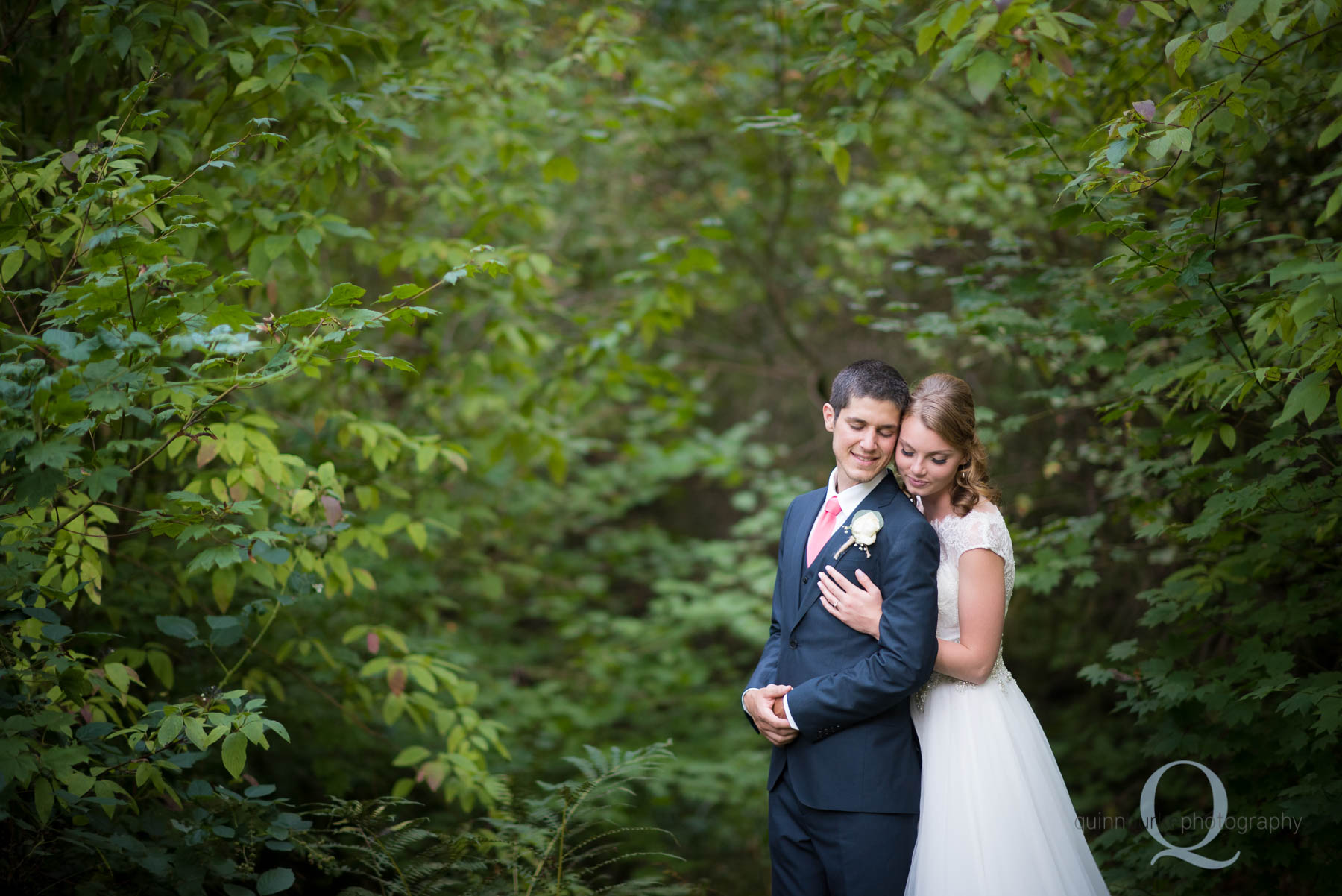 bride and groom in the trees at rons pond