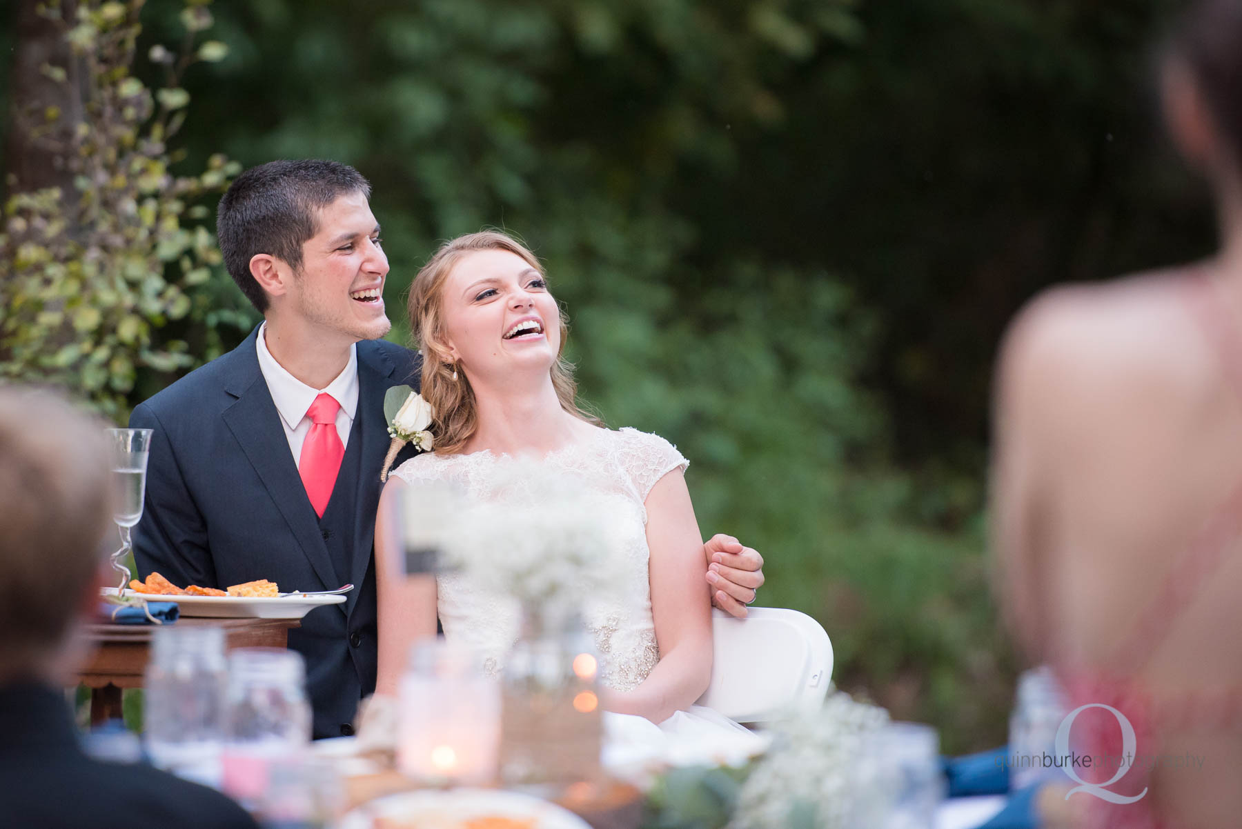 bride and groom listening to toasts at wedding