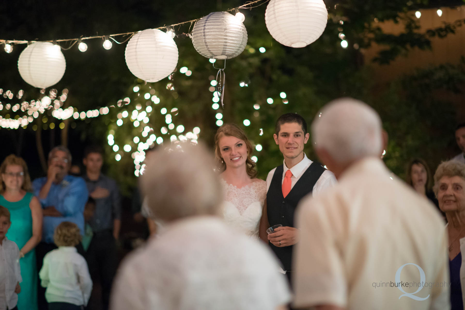 grandparents giving advice to bride and groom during wedding reception