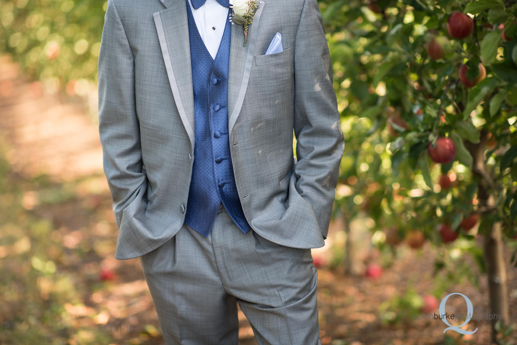 wedding groom in orchard at Perryhill Farm