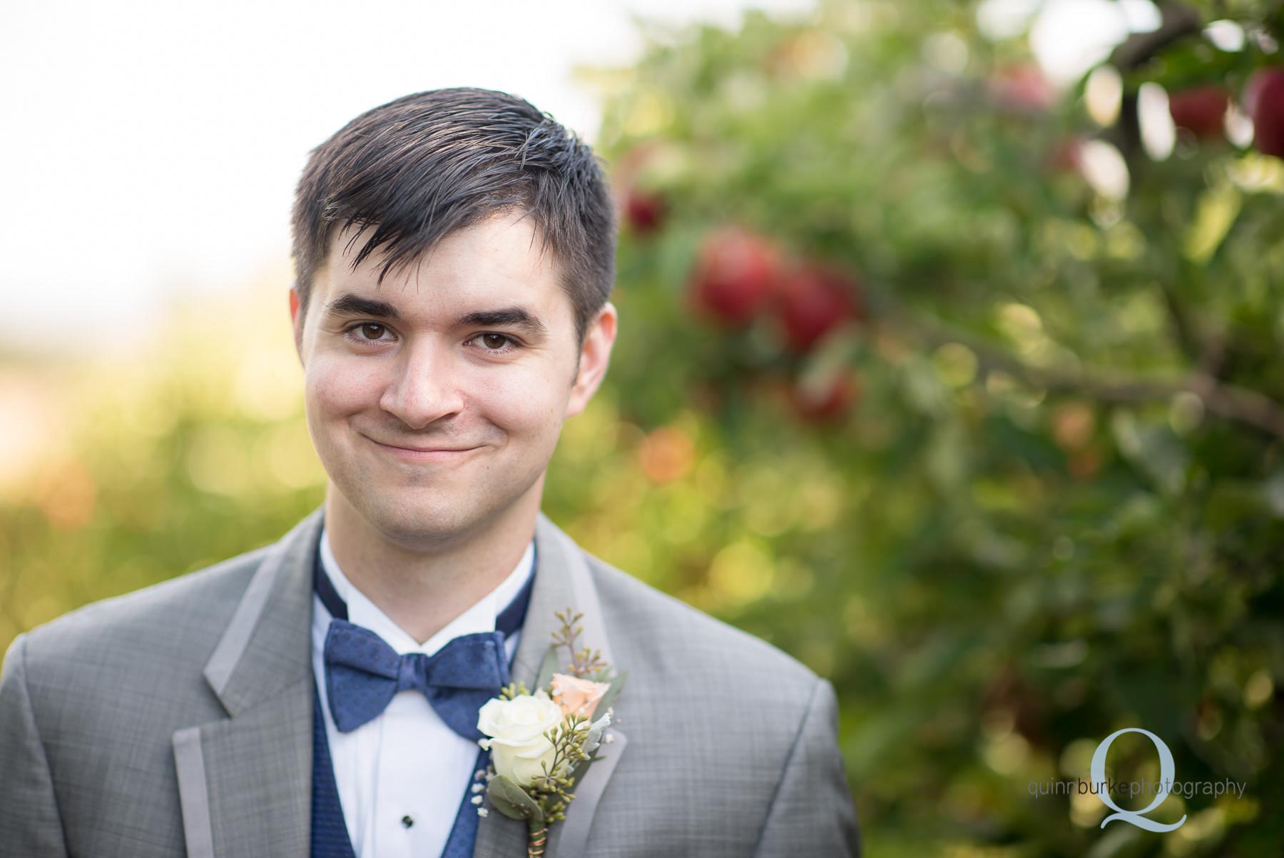 groom in apple orchard in dallas oregon