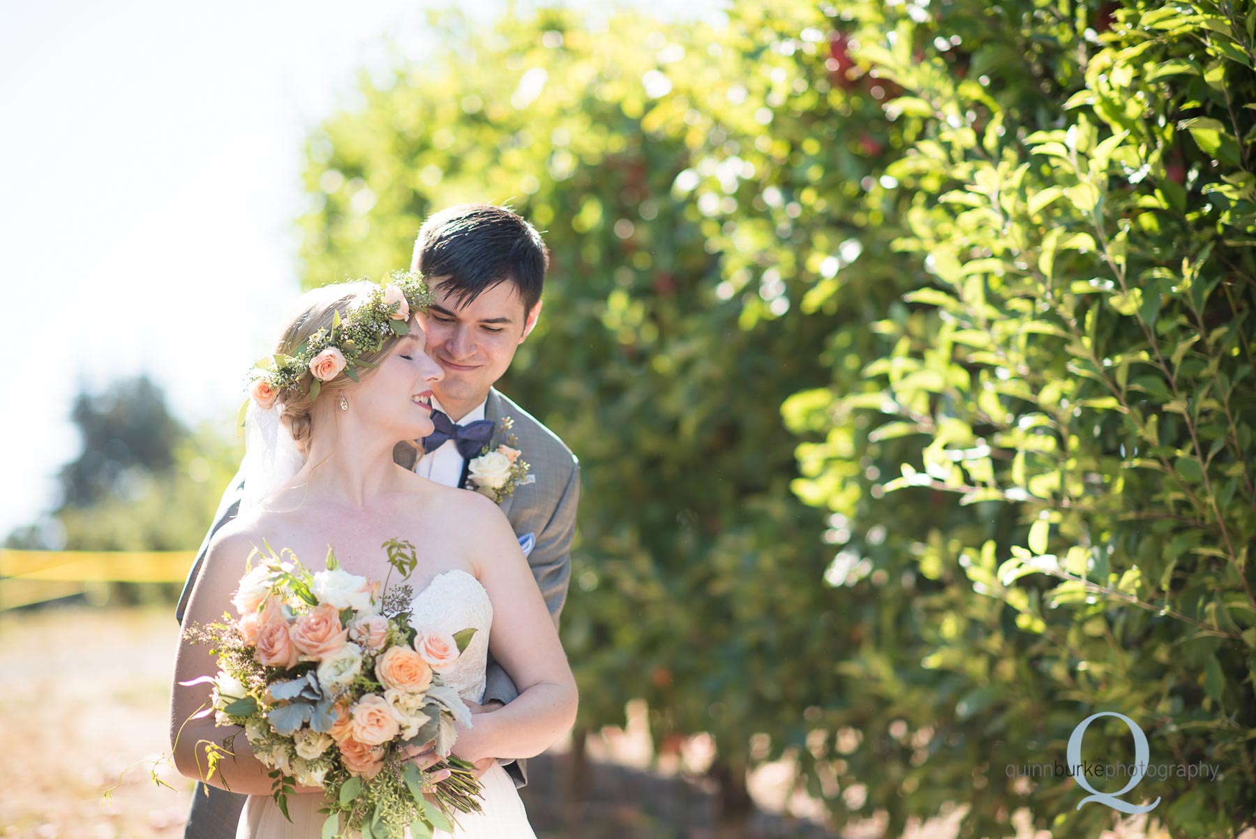 bride and groom in orchard at Perryhill Farm wedding
