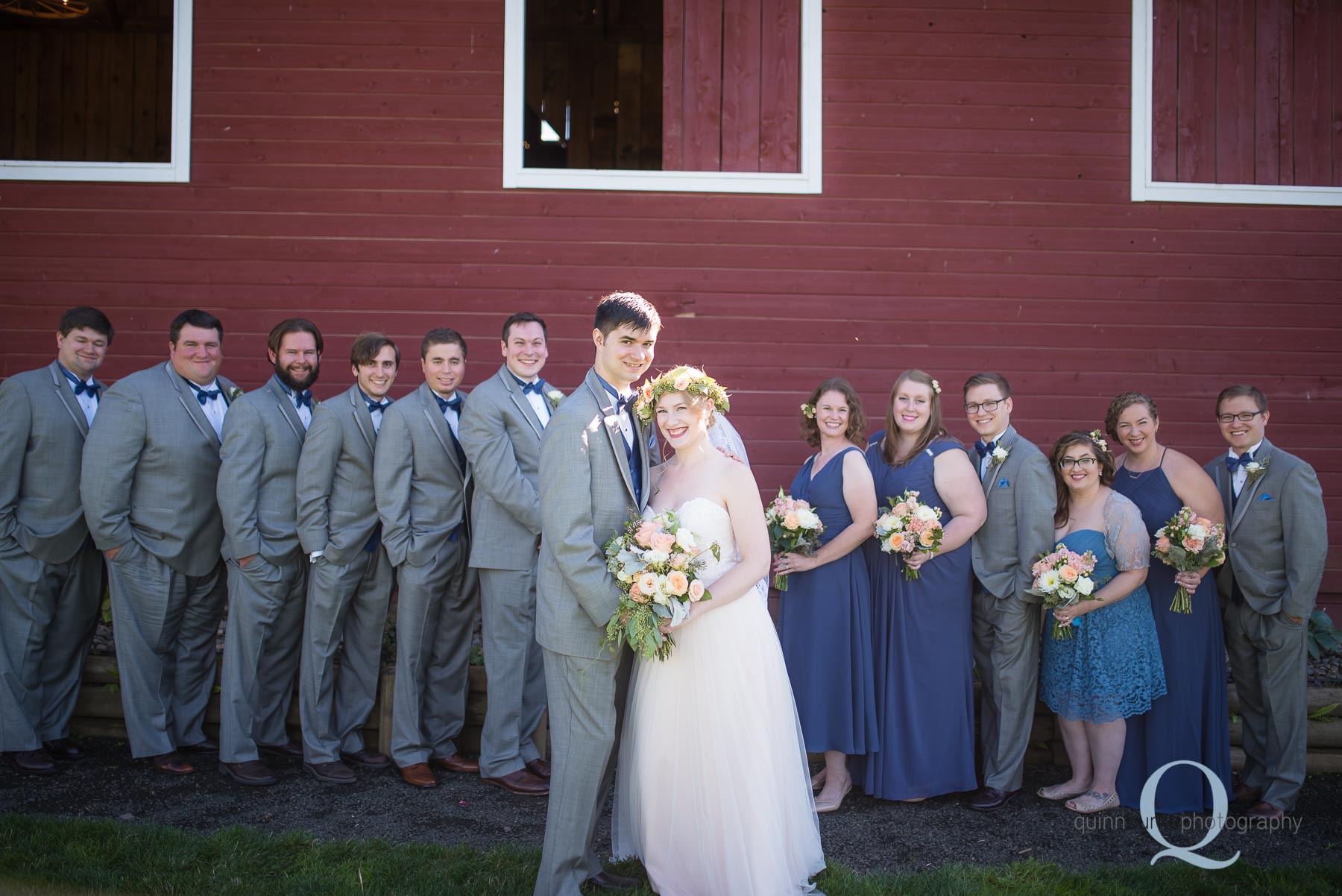 Perryhill Farm wedding party in front of barn