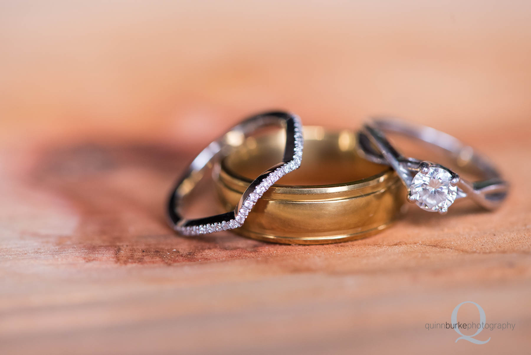 wedding rings on wood cut base