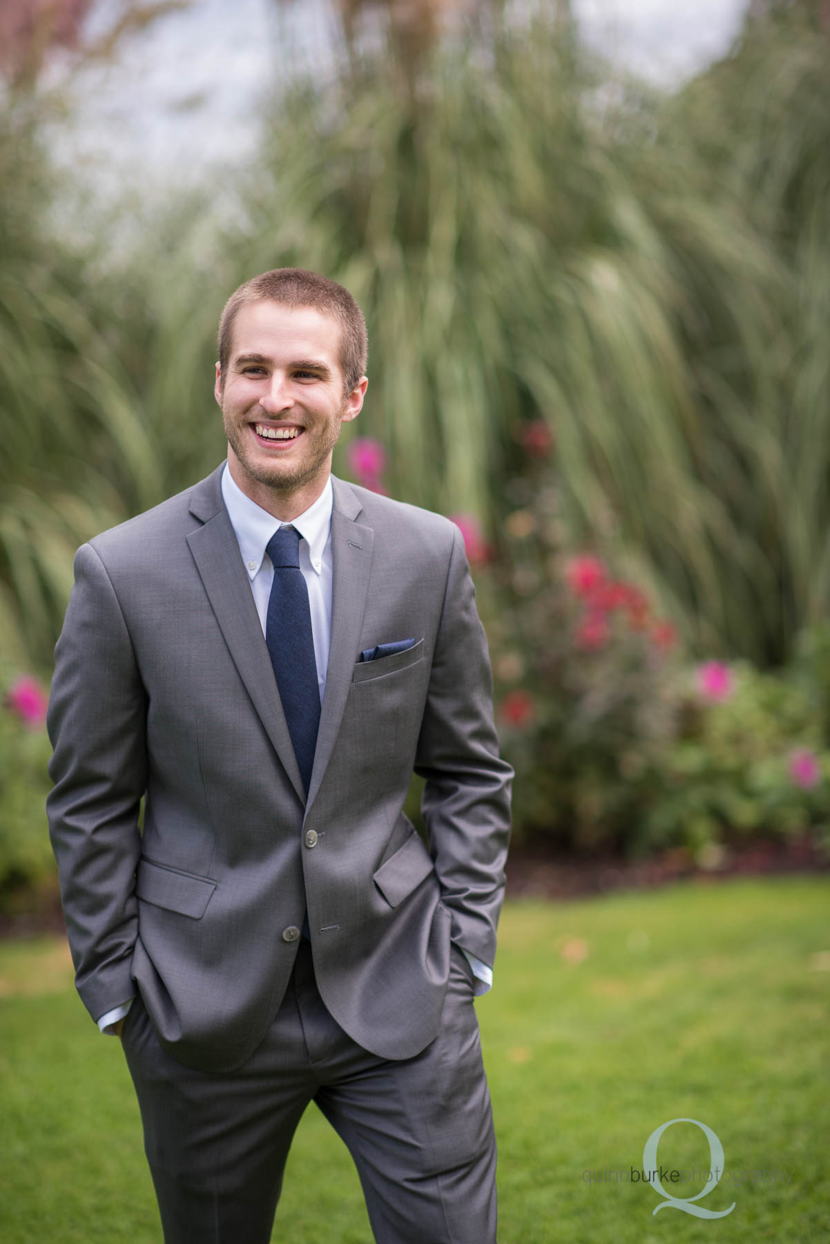 groom in garden at Green Villa Barn before wedding