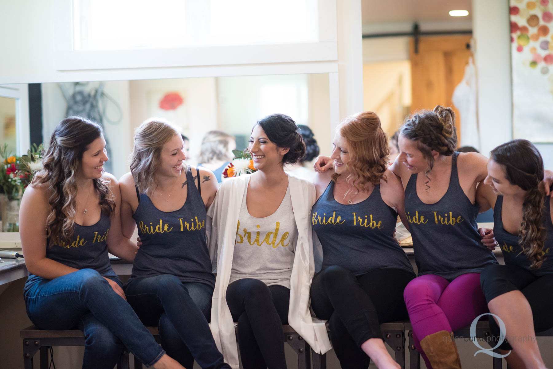 bride and bridesmaids with custom shirts before wedding Green Villa Barn