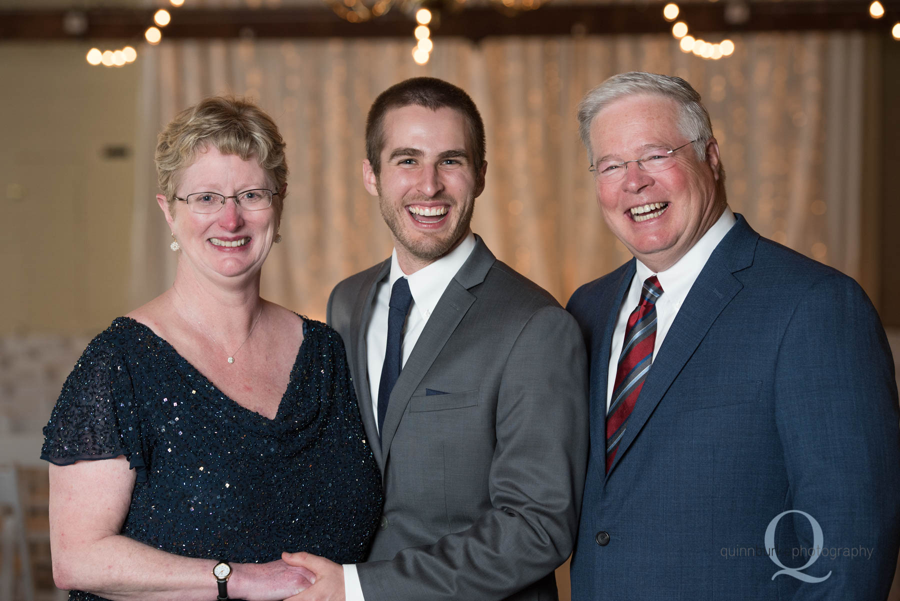 groom and mom and dad before Green Villa Barn wedding