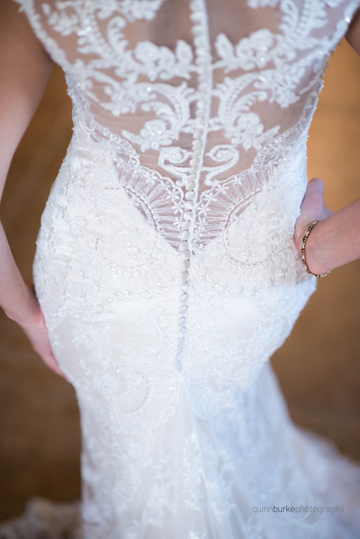 back of bride's wedding dress at Green Villa Barn