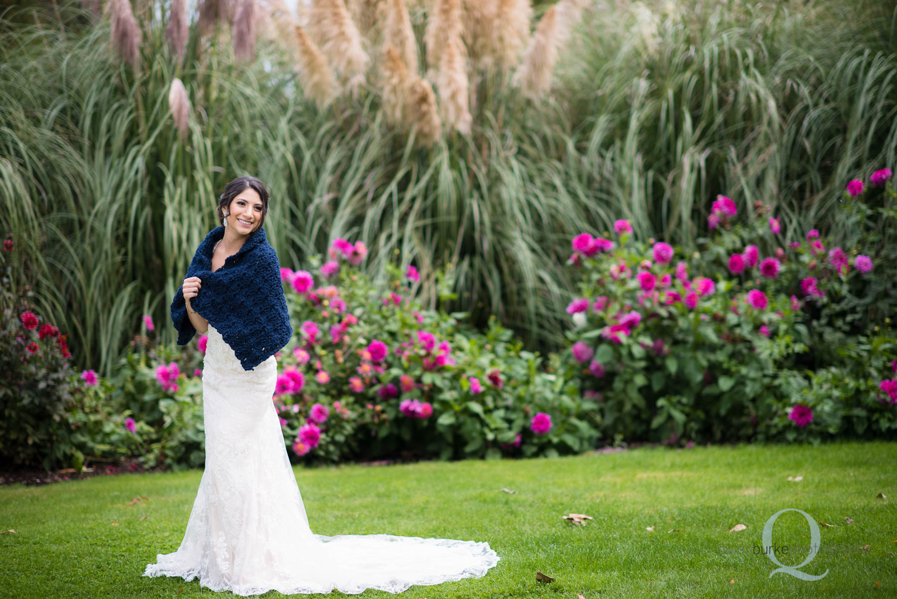 full body of bride in wedding dress and shawl at Green Villa Barn