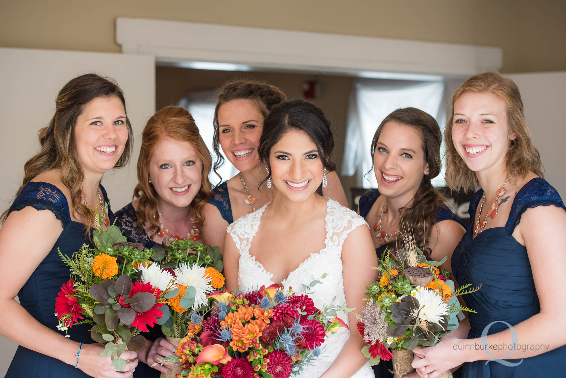 bride and bridesmaids in entrance of Green Villa Barn