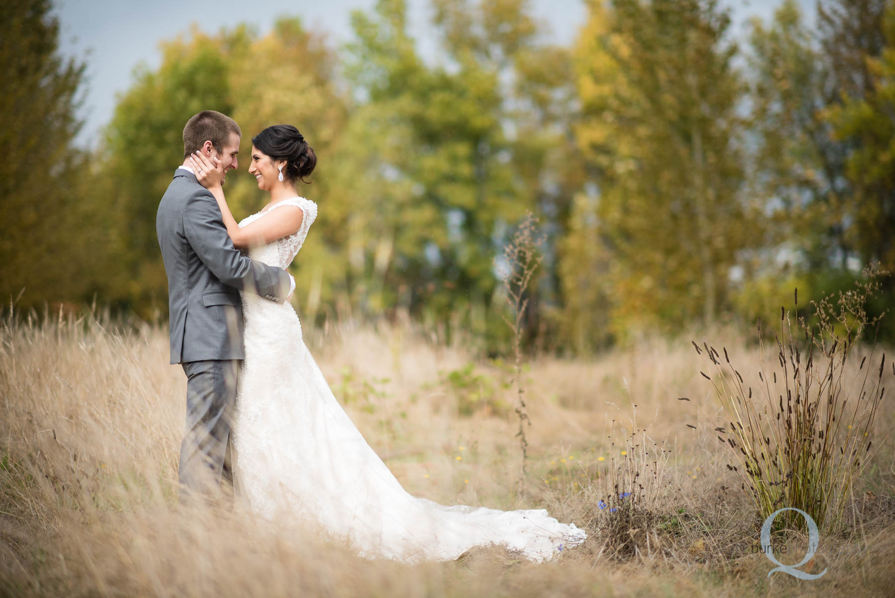 bride and groom in field at Green Villa Barn