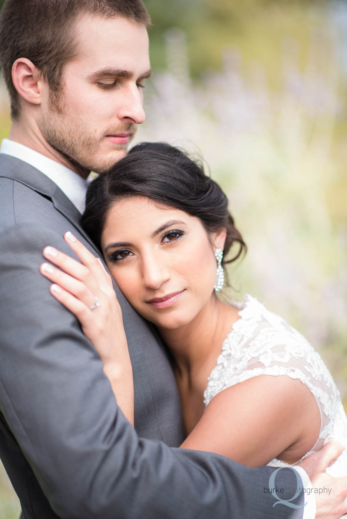 bride with head on grooms chest at Green Villa Barn