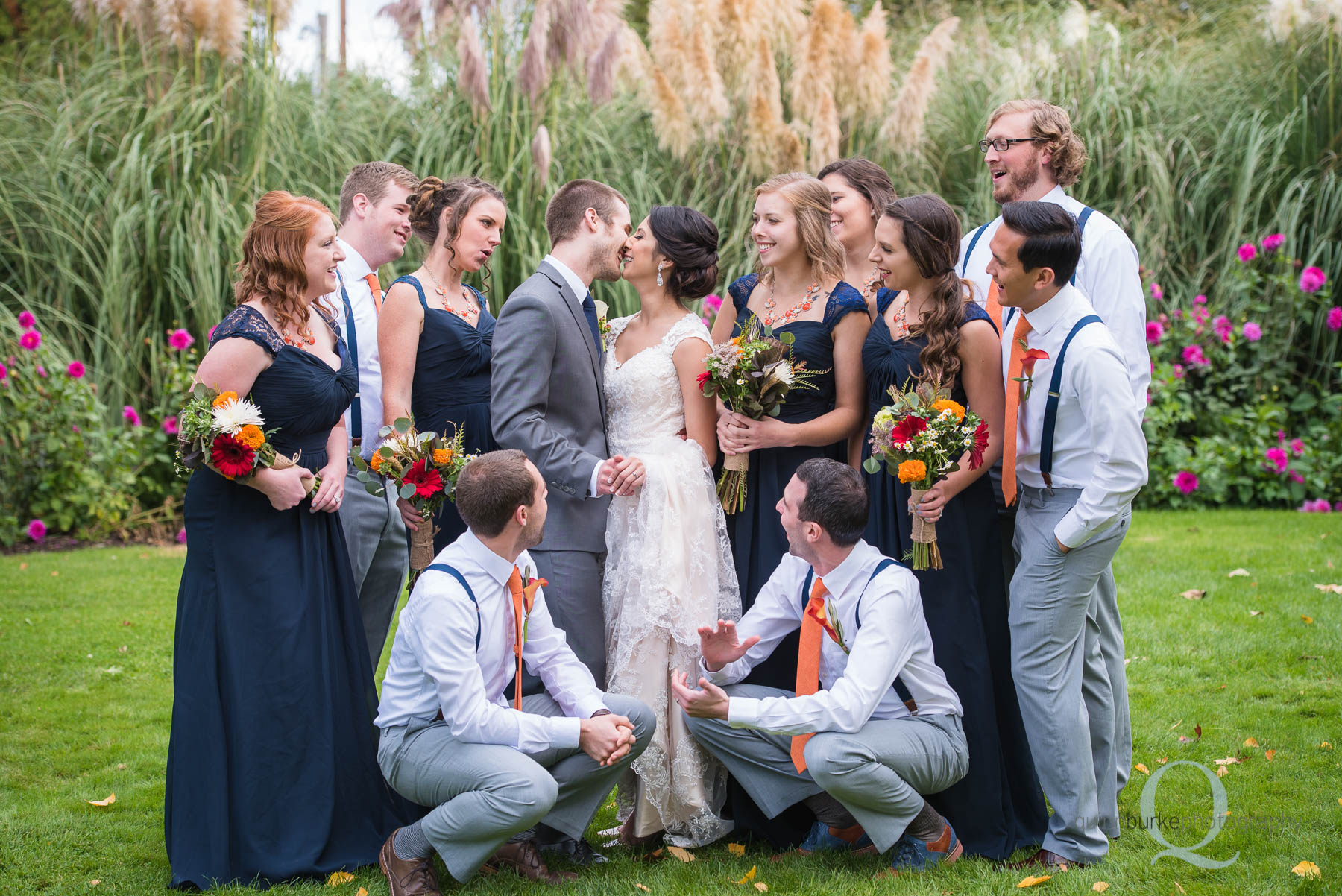 Green Villa Barn wedding party bride and groom kissing