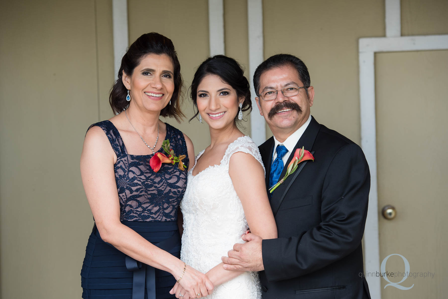 bride with mom and dad before wedding at Green Villa Barn