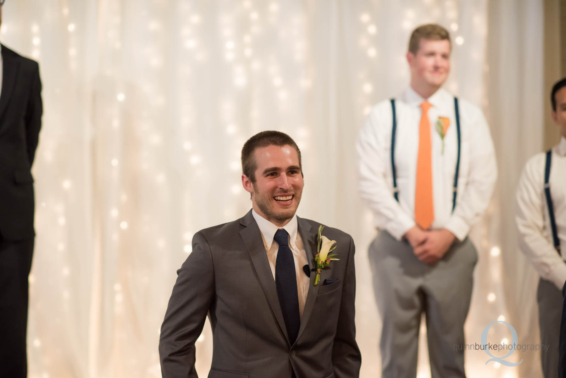 emotional groom sees bride at wedding ceremony at Green Villa Barn