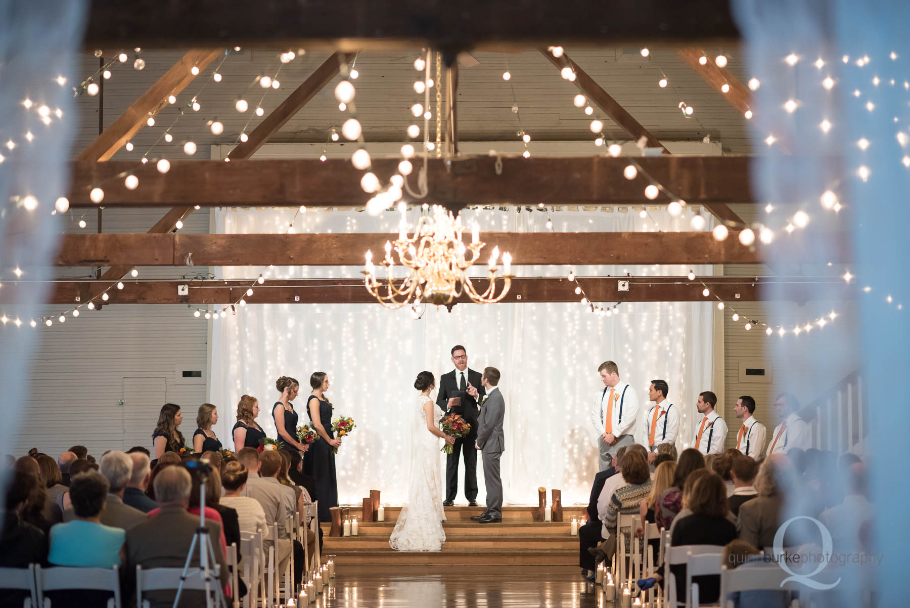 Green Villa Barn wedding ceremony in barn