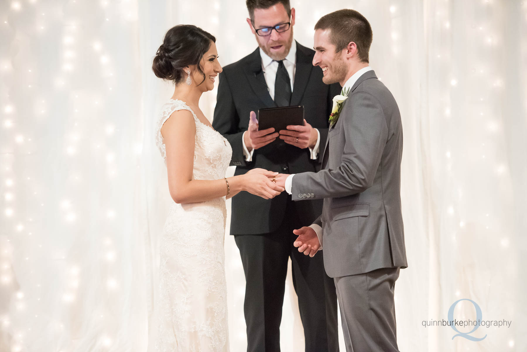 bride and groom holding hands wedding ceremony Green Villa Barn