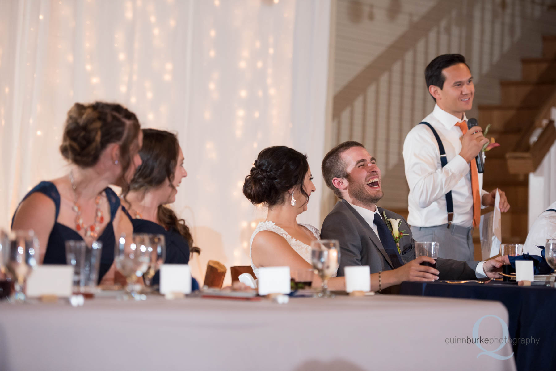 groomsmen toast during reception at Green Villa Barn